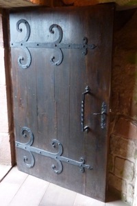 A lovely old door with decorative iron bands