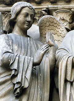 An angel stands next to Saint Denis